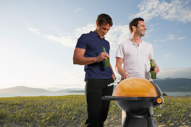 Men Barbecuing on an Island --- Image by © Image Source/Corbis