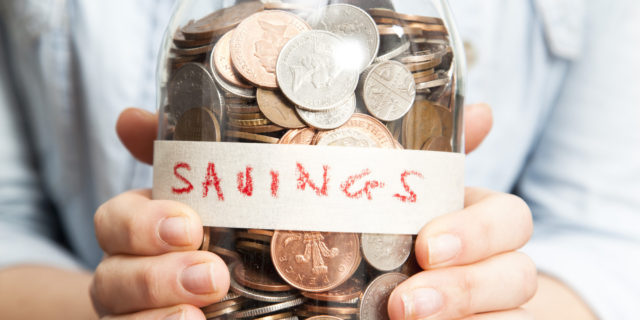 Woman with coins in jar