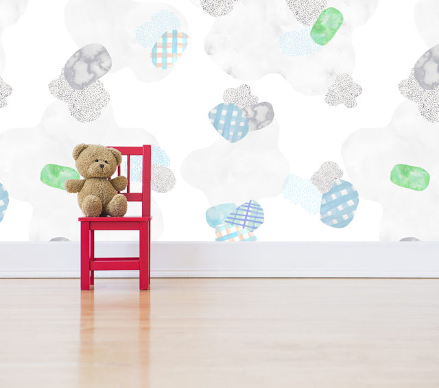 Studio shot of teddy bear sitting on red chair