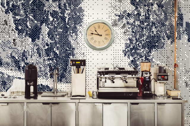 Various coffee makers on commercial kitchen counter