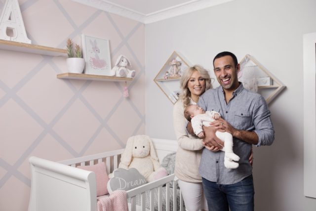 adam-and-lisa-hold-arabella-infront-of-the-bebe-care-imperio-cot-bed