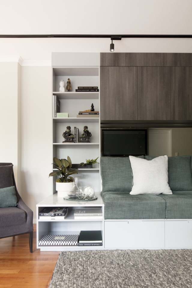 The new living room features fabulous built-in storage and seating