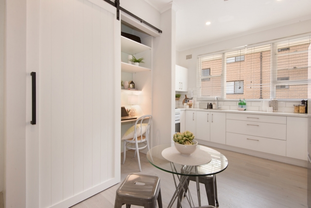 AFTER kitchen & study nook featuring a barn door