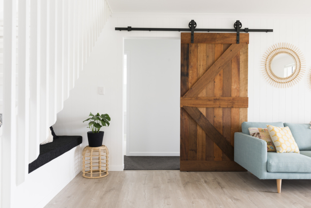 The custom designed reclaimed barn door was one of the build's special splurges