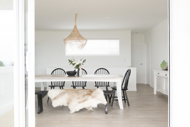 The dining room features a DIY upcycled table