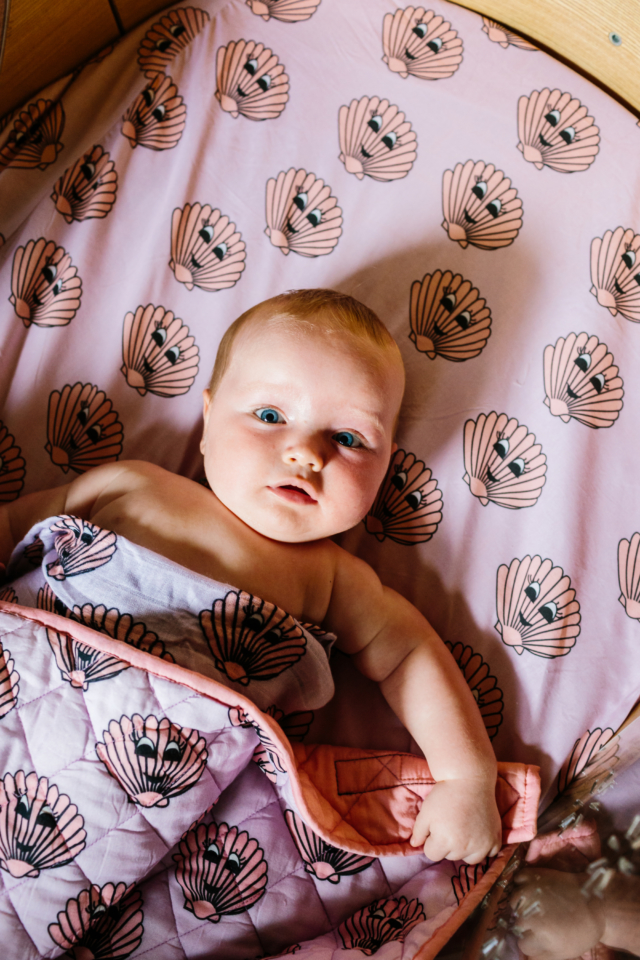 Kip&Co X Hugo Loves Tiki 'Sea shells' print fitted cot sheet and quilted blanket