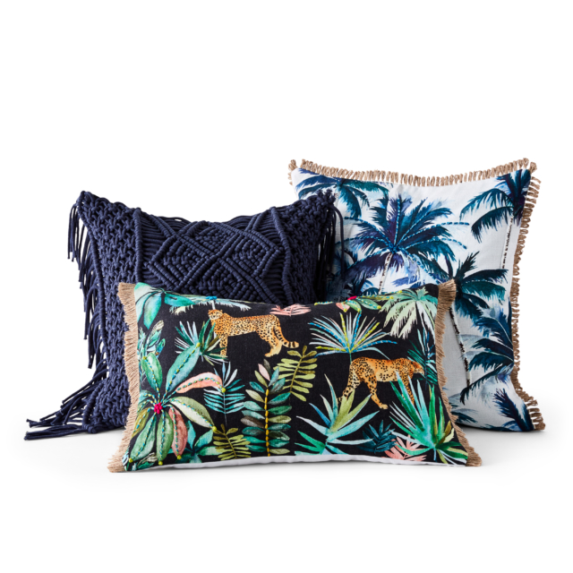 Clockwise from left: 'New Haven' macrame' cushion in indigo, 'Key West Palms' cushion in indigo, ' and the 'Welcome to the jungle' cushion in 'cheetah night'