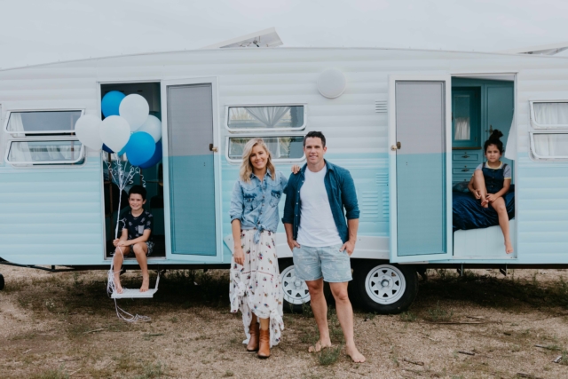 Carlene and Michael Duffy in front of their latest caravan renovation 'Dolly'