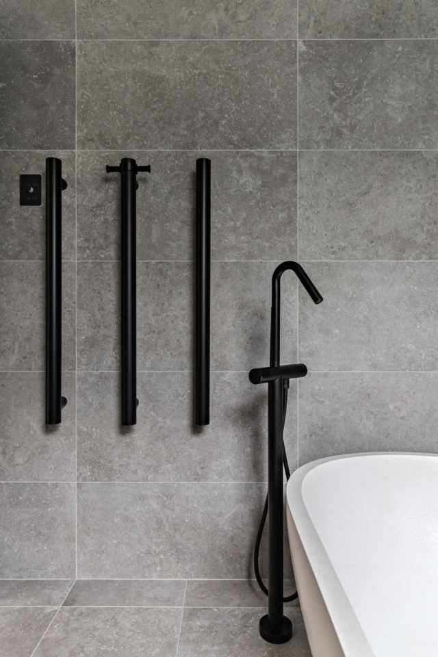 AFTER Horizontal heated towel rails were a space-saving solution