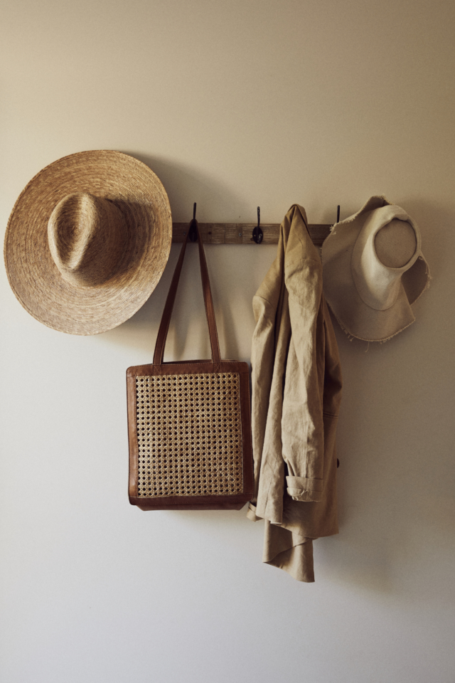 A coat rack features St Agni.'s best selling 'Hennie' rattan bag