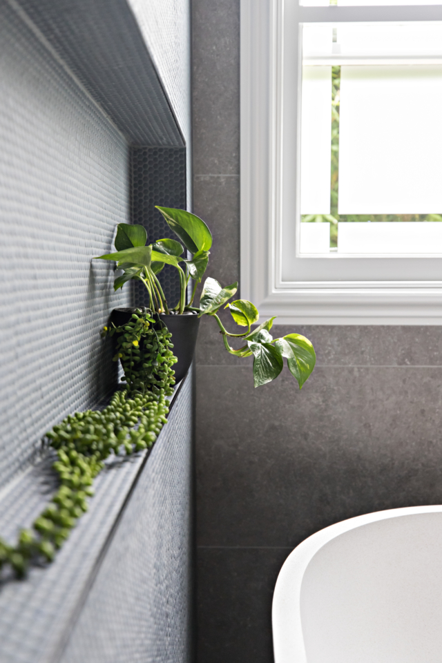 AFTER The wall niche behind the bath is the perfect spot for a splash of green