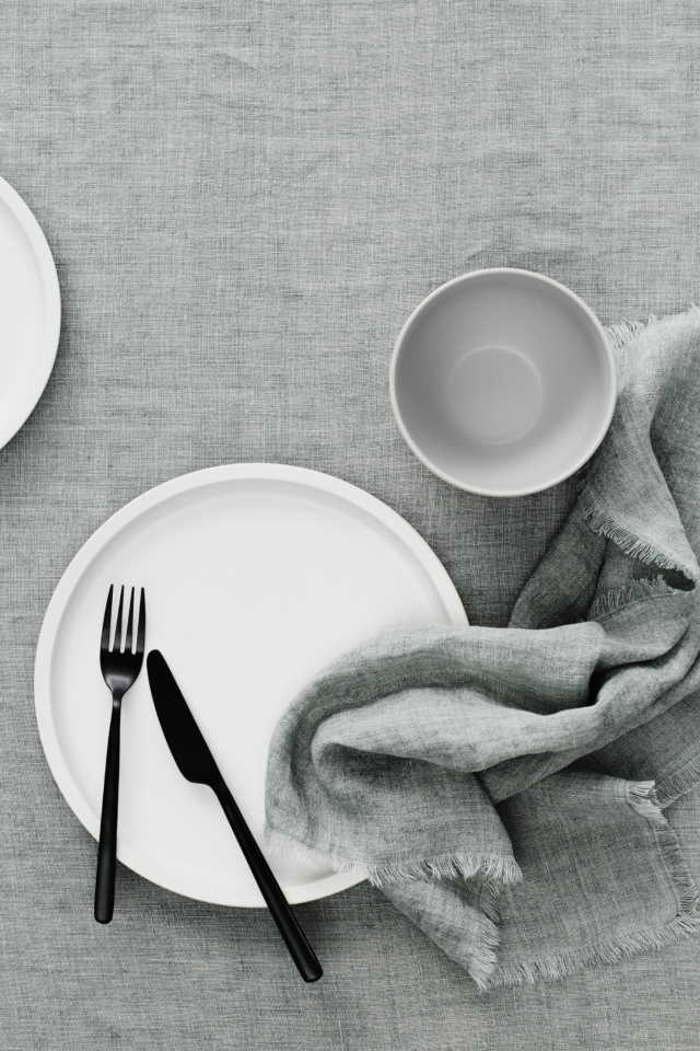 Vintage fringed table linen in limestone