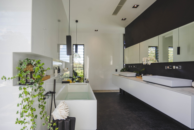 Pendants provide mood lighting in the bathroom. Image: Jake Magnus