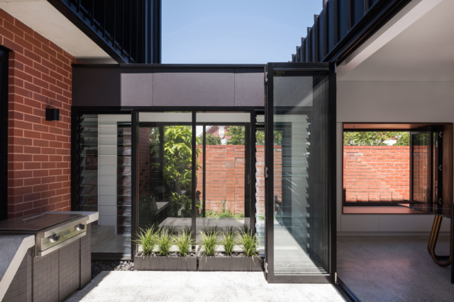 An external courtyard connects the old and new parts of the home