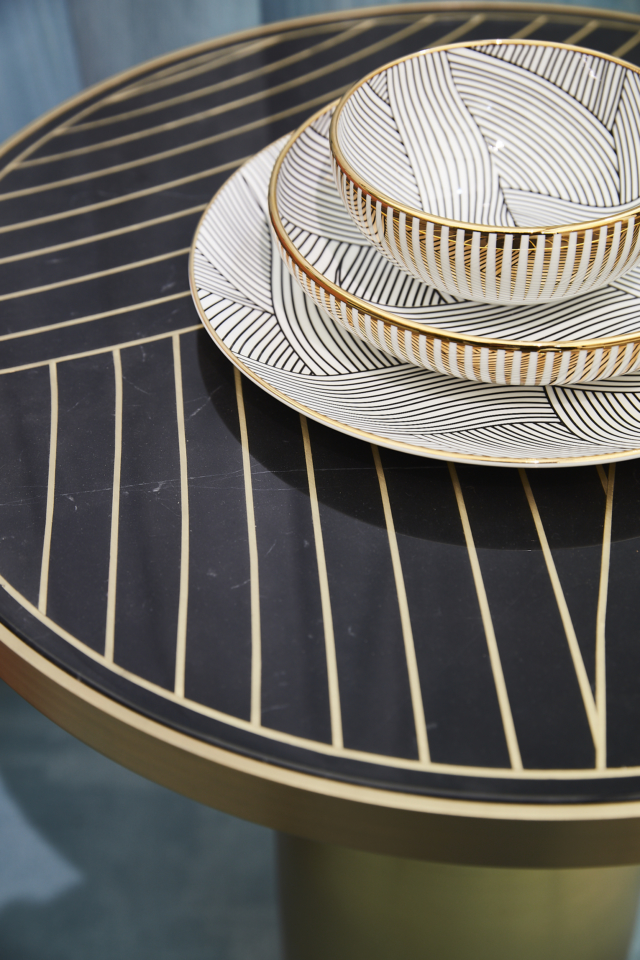 The Lustre table and tableware features a design inspired by sail boats