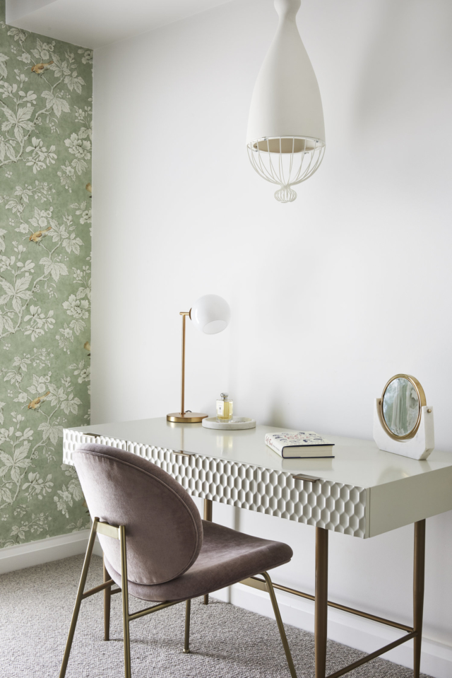 A LightCo pendant floats above the desk