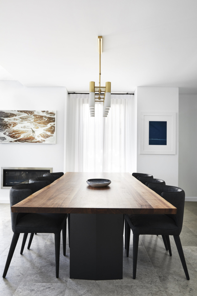 A LightCo pendant light hangs above the dining table