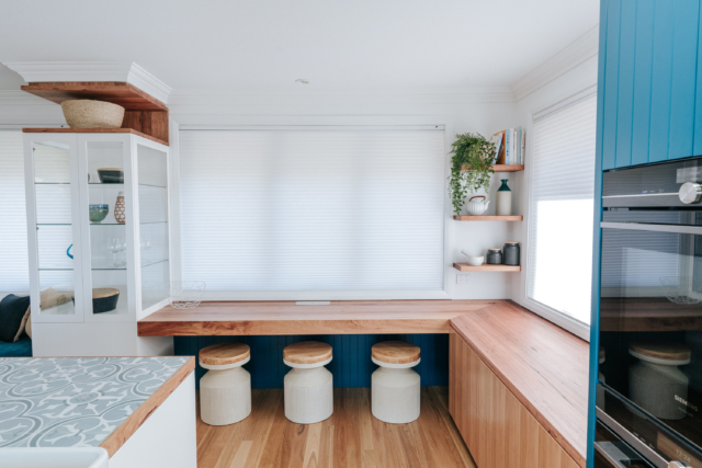 This Birdblack Design kitchen renovation included window seating to take in the coastal view