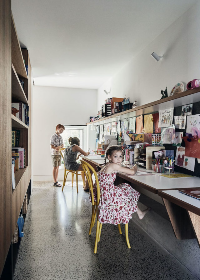 The kids' study has an abundance of toy storage