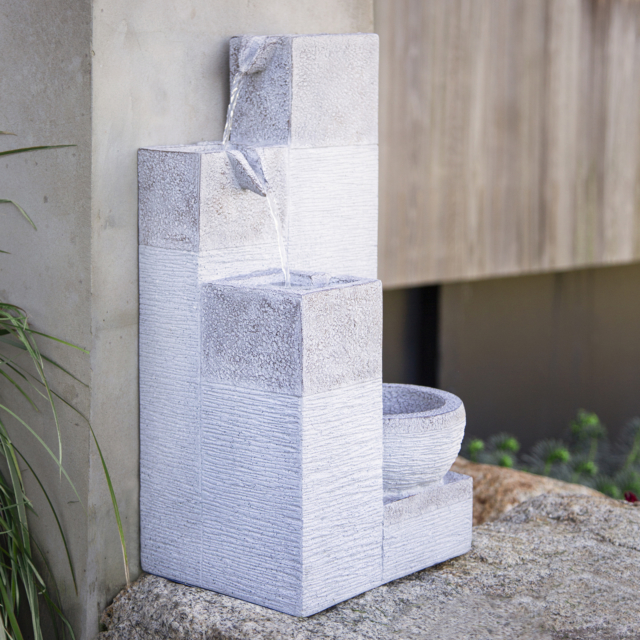 Another way to create low maintenance interest is through the addition of a water feature. This is Northcote Pottery's ‘Summit’ design