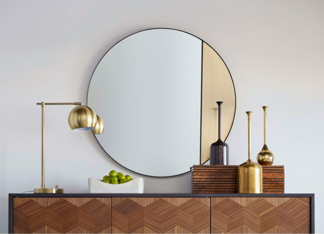 The mid-century inspired Jonsi mirror features inset brass detailing
