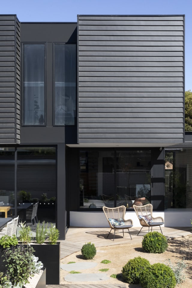 Weatherboards were an obvious choice for the upper-level as they complement the front of the home.