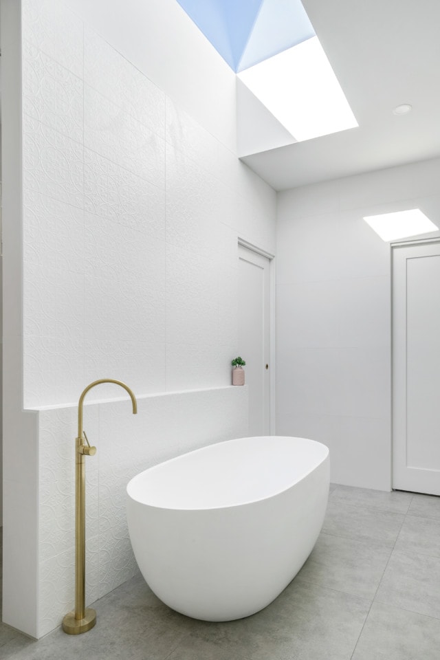 A skylight above the girls' bathtub gives the room a real feeling of airiness.