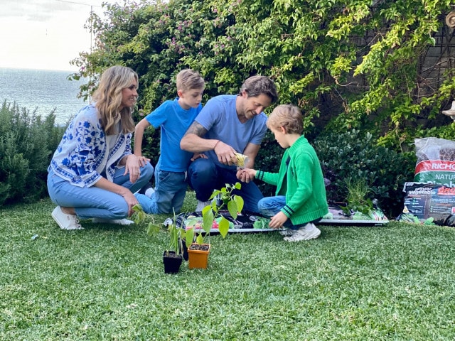 Juliet and Charlie in the garden with their two sons