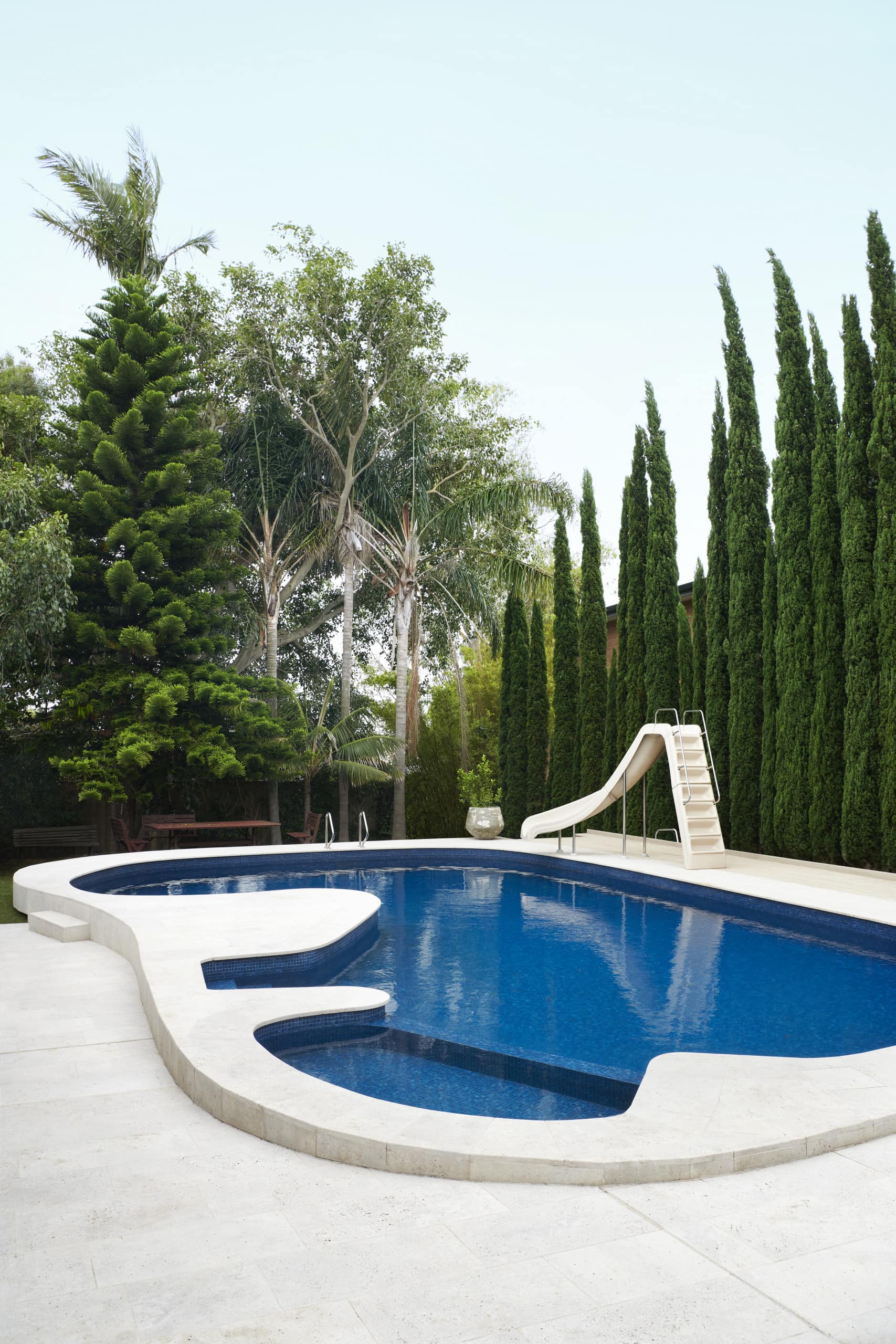 A kidney shaped pool keeps the kids entertained 