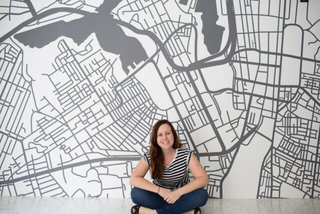 Kylie Harber in front of her Sydney mural