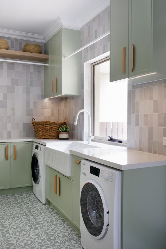 Dreamy sage laundry with custom storage galore and stunning tiles - The Interiors Addict