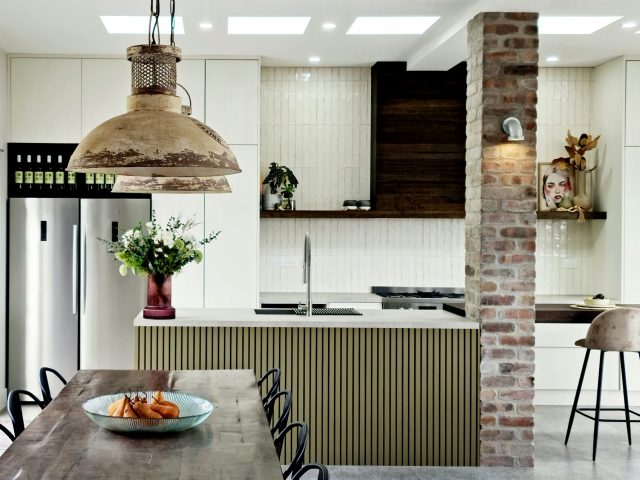 DIY kitchen makes feature of support beam with recycled brick