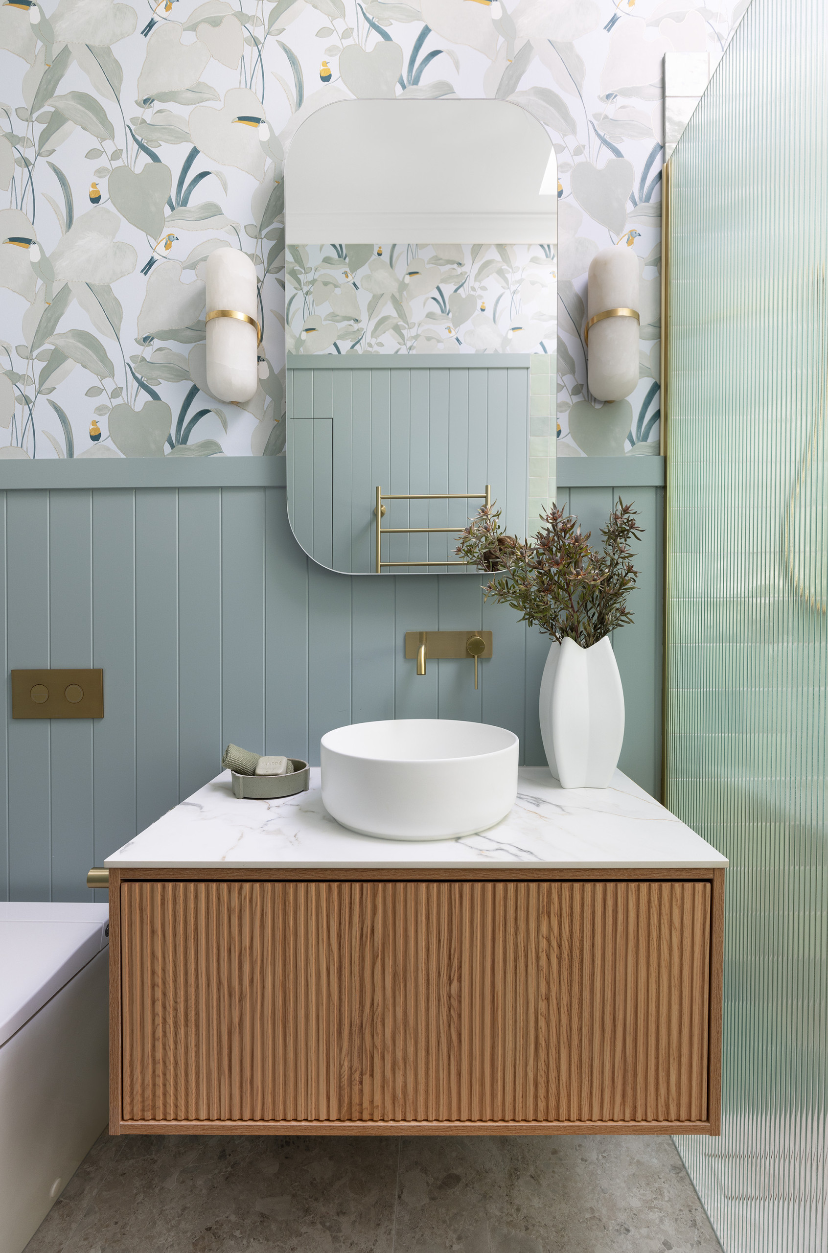 A stunning sage green bathroom transformation with wallpaper The