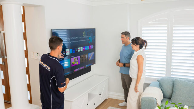 Wall-mounted TV installed with hidden cabling in a finished living room